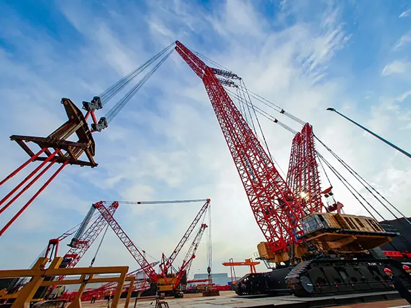 The massive SANY SCC9800TM crawler crane during assembly or operation